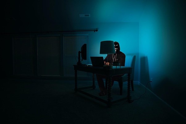 TTT_Blog-Which-Type-of-Hacker-is-Endangering-Your-Business-Data-Featured-Image.jpg man siting facing laptop